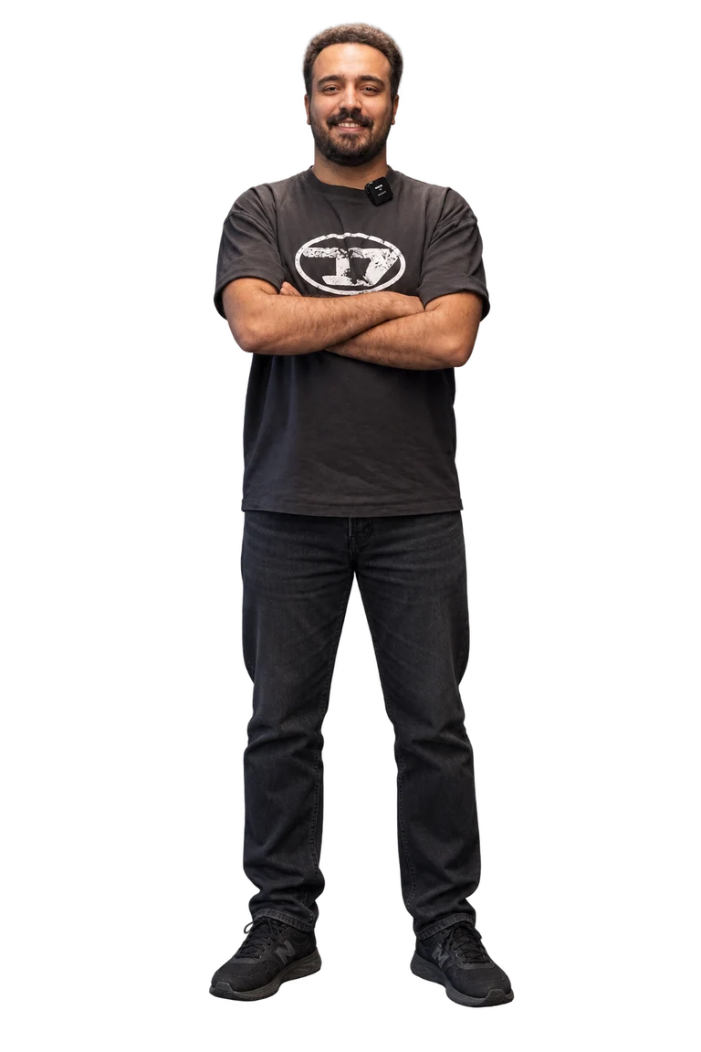 Mehdi Ghadiri zade standing with his arms crossed